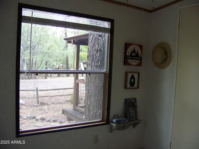 a bathroom with a granite countertop sink a toilet and a mirror