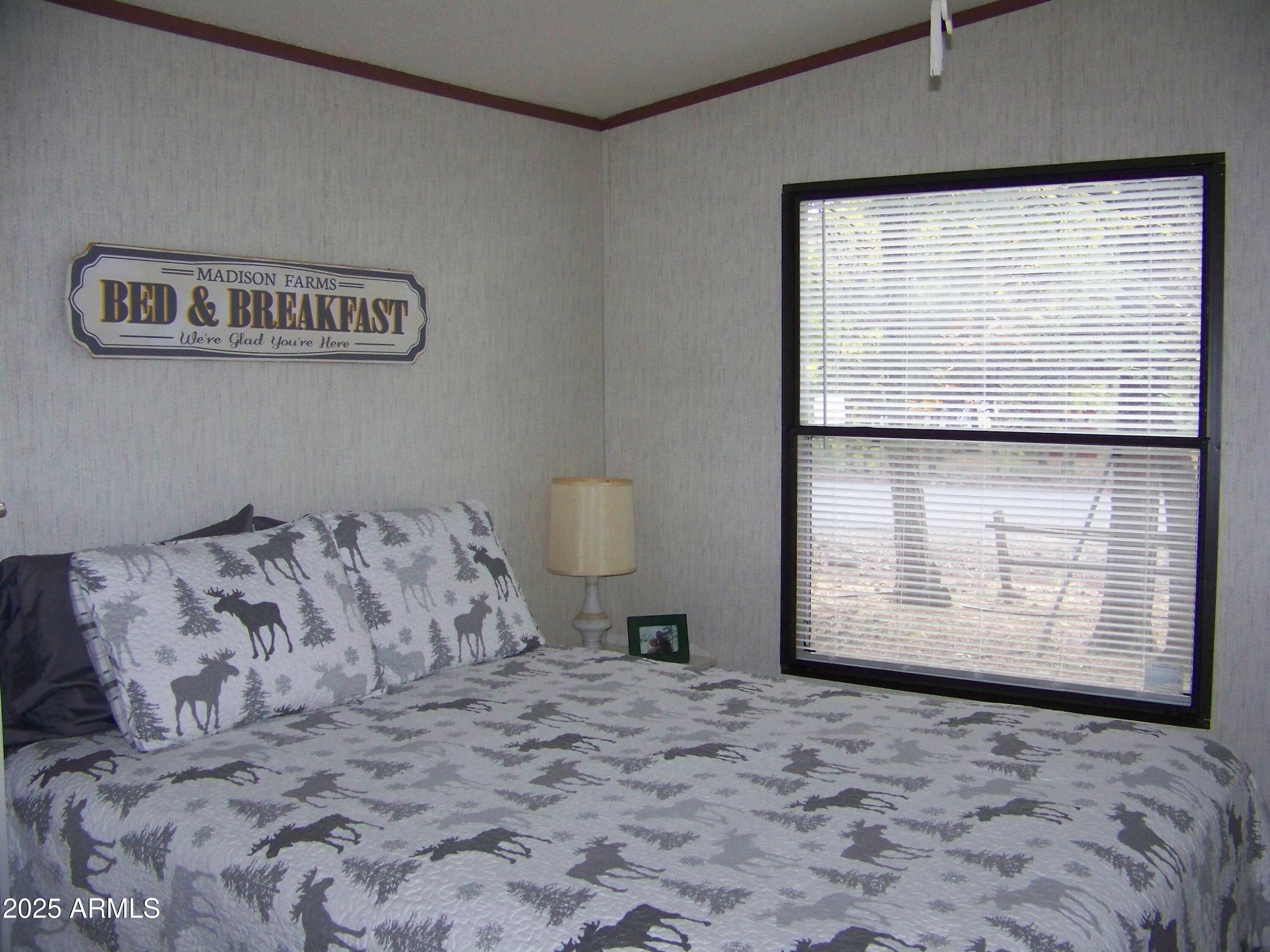 1167 White Tail Lane Pinetop, AZ 85935 - Photo 29 of 58 a bedroom with a bed and a window