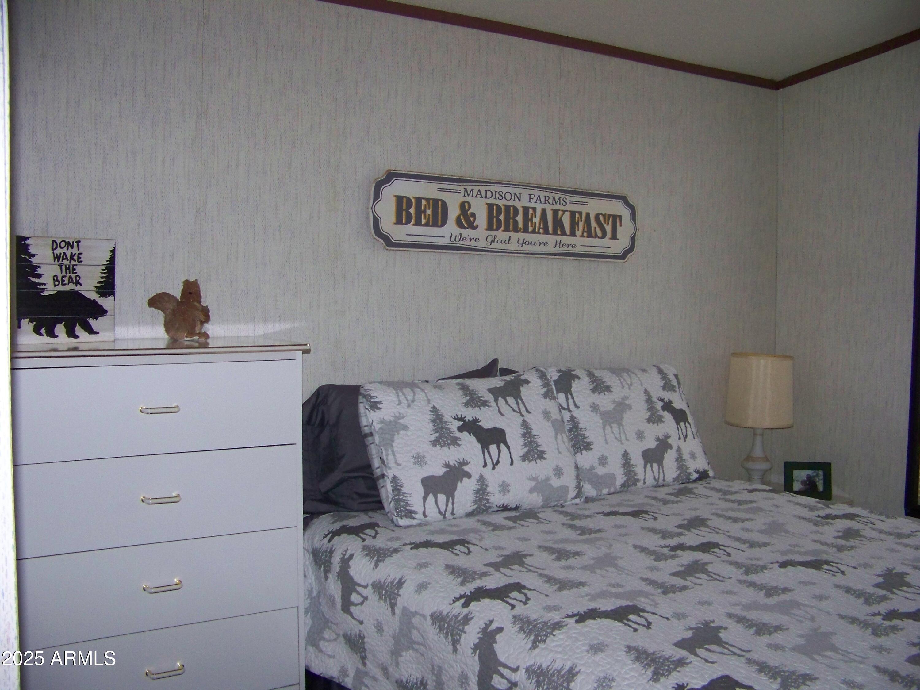 1167 White Tail Lane Pinetop, AZ 85935 - Photo 31 of 58 a bedroom with a bed and a cabinets