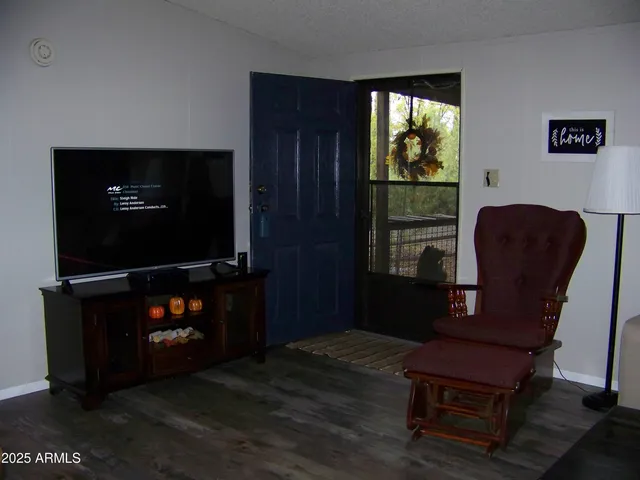 a kitchen with stainless steel appliances a stove a table and chairs in it