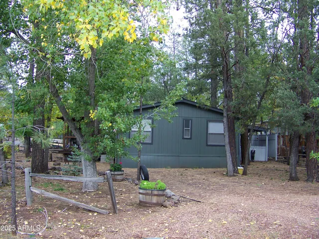 a view of a tree in front of a house