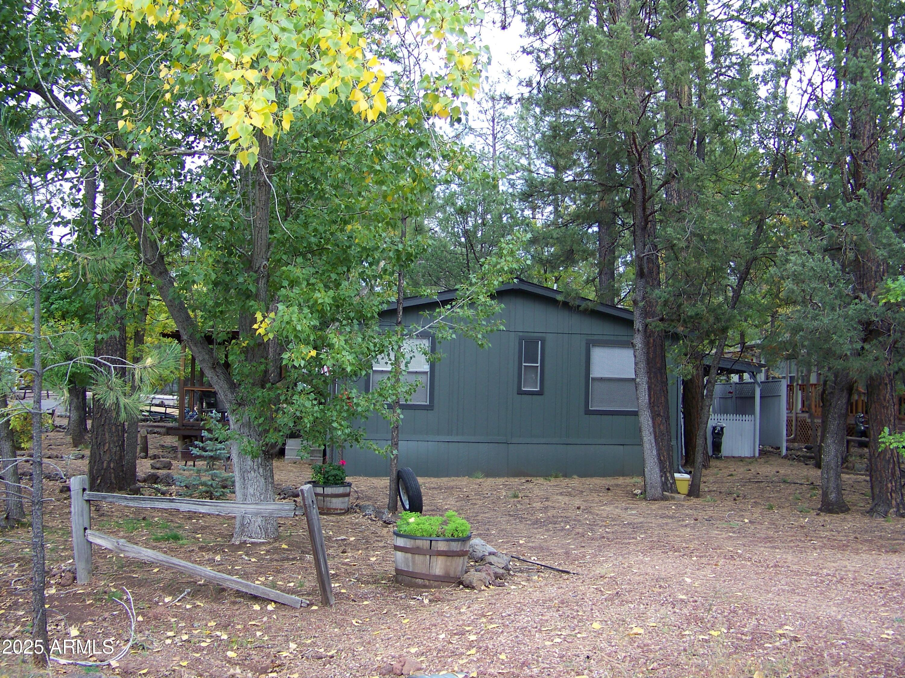 1167 White Tail Lane Pinetop, AZ 85935 - Photo 44 of 58 a view of backyard with outdoor and trees