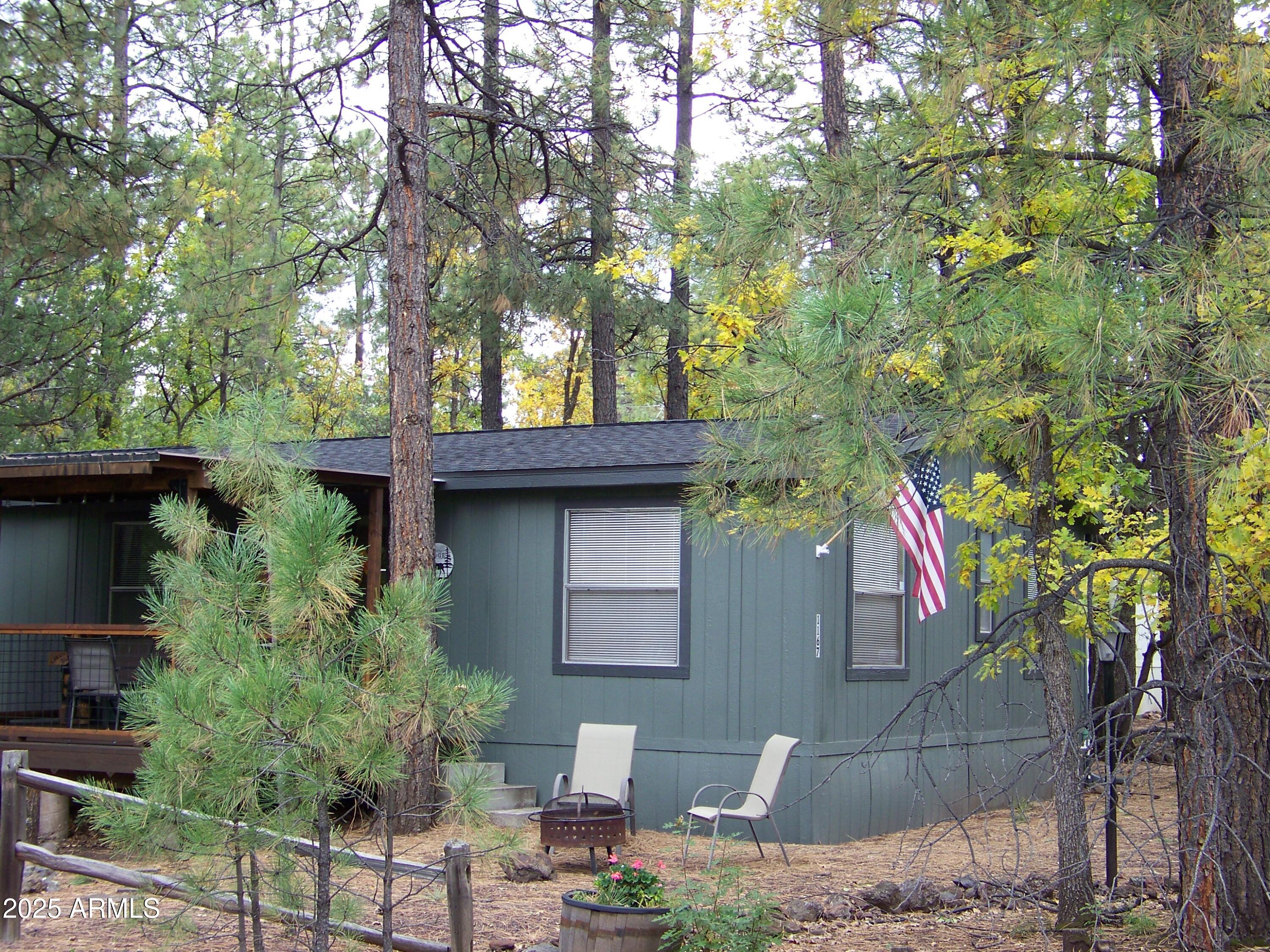 1167 White Tail Lane Pinetop, AZ 85935 - Photo 48 of 58 a small garden covered with tall trees