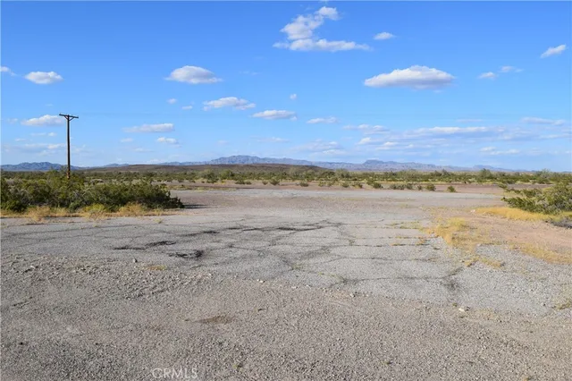 a view of an ocean beach and a city