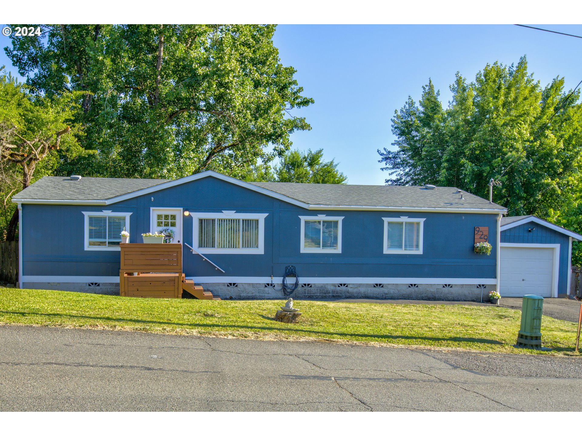 929 Northeast Rifle Range Street Roseburg, OR 97470 - Photo 1 of 48 a front view of a house with a yard