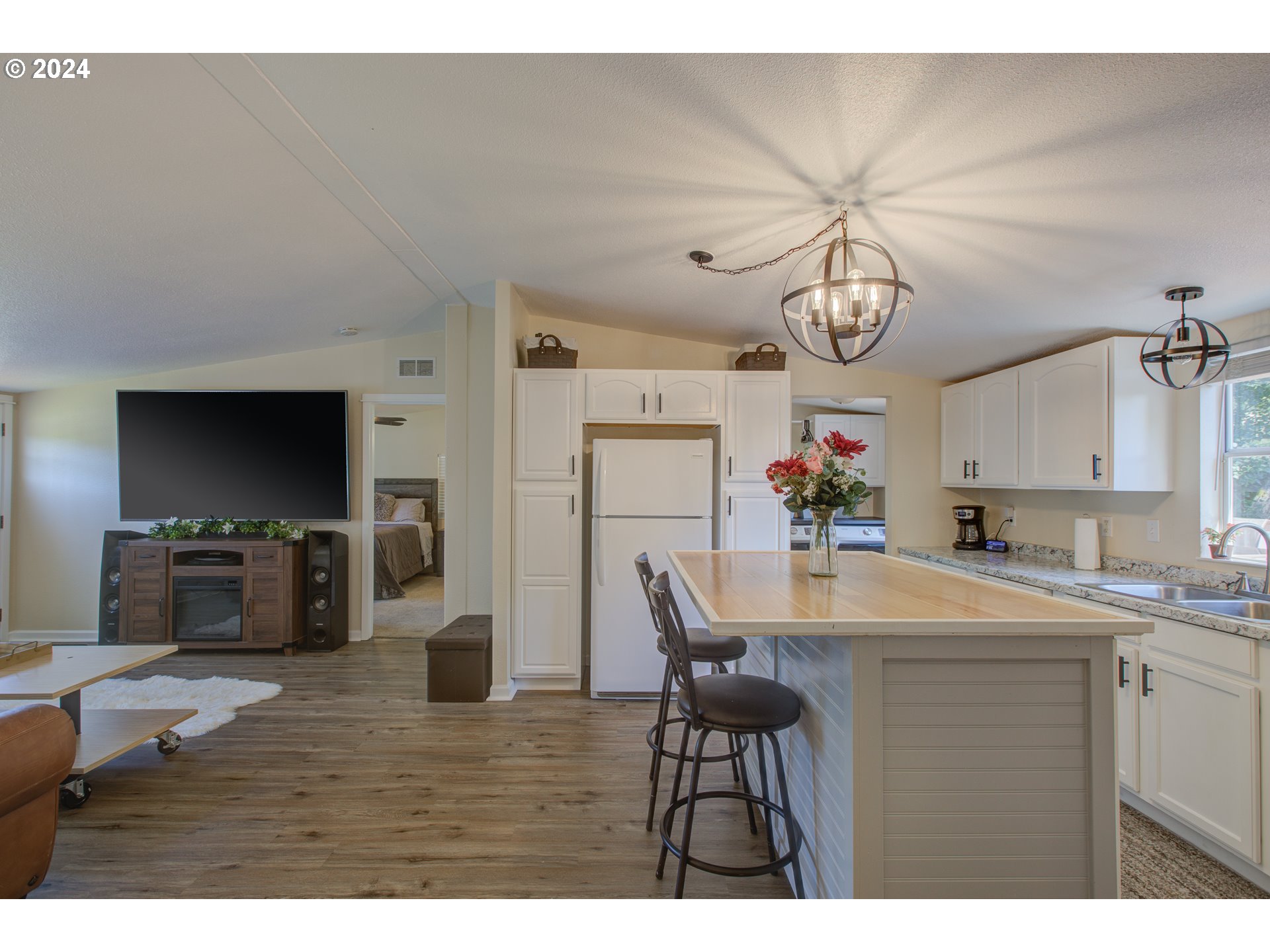929 Northeast Rifle Range Street Roseburg, OR 97470 - Photo 13 of 48 a view of kitchen and sink with wooden floor