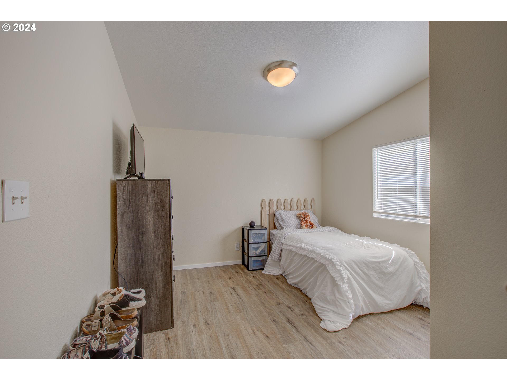 929 Northeast Rifle Range Street Roseburg, OR 97470 - Photo 26 of 48 a bedroom with a bed and a television