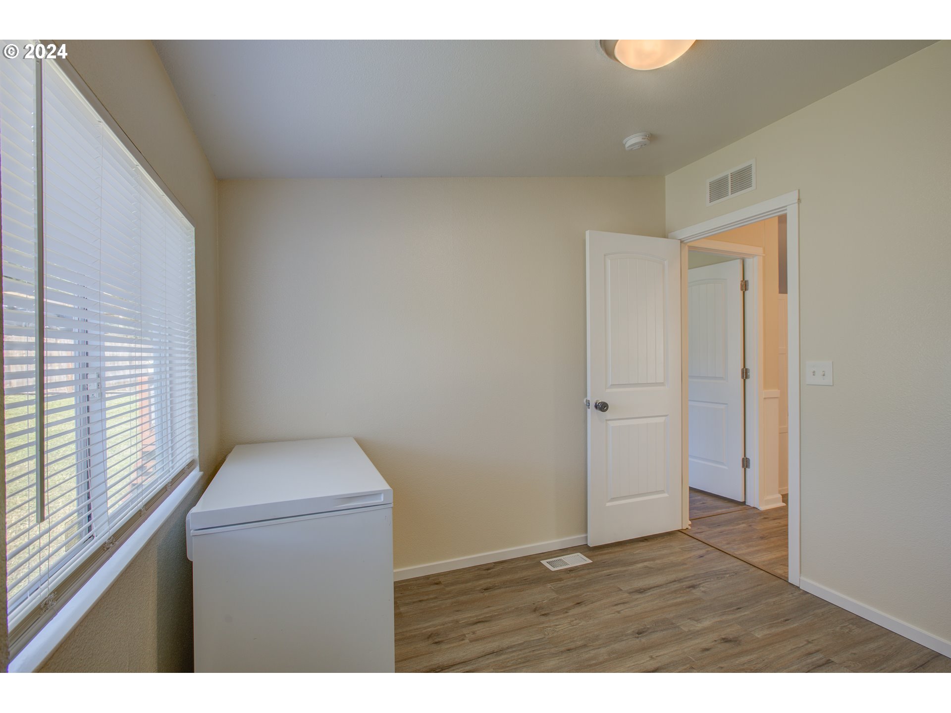 929 Northeast Rifle Range Street Roseburg, OR 97470 - Photo 33 of 48 a kitchen with a wooden floor and a window