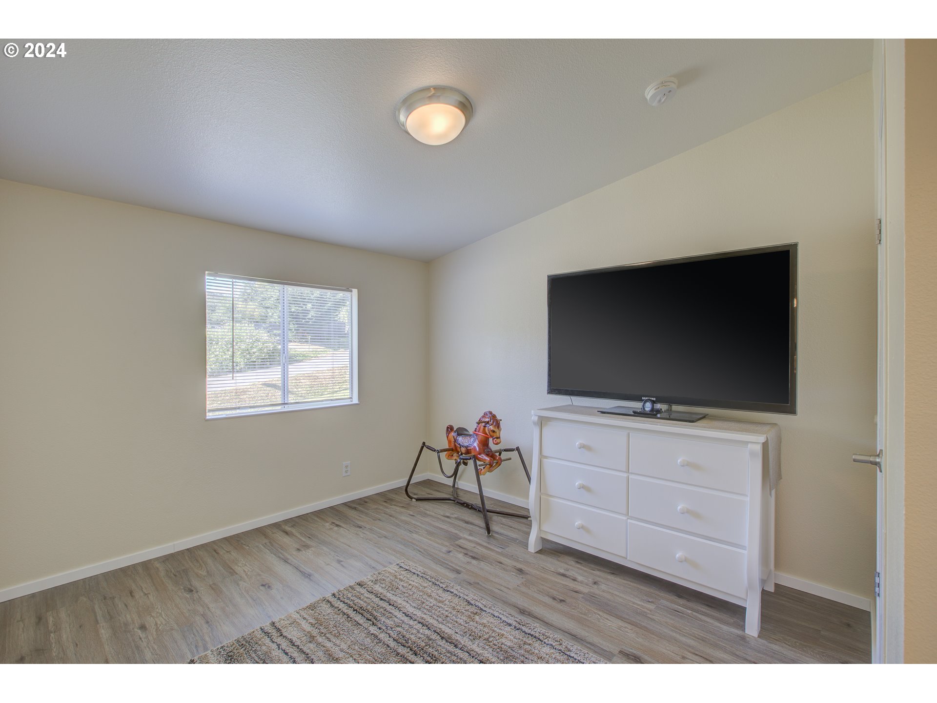 929 Northeast Rifle Range Street Roseburg, OR 97470 - Photo 34 of 48 a living room with furniture and a flat screen tv