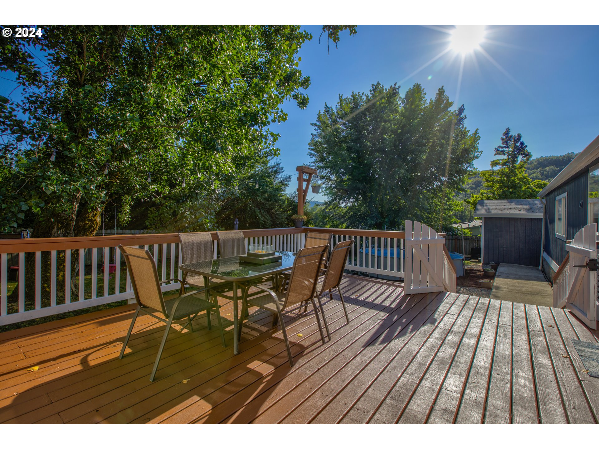 929 Northeast Rifle Range Street Roseburg, OR 97470 - Photo 40 of 48 a view of balcony with wooden floor and outdoor seating