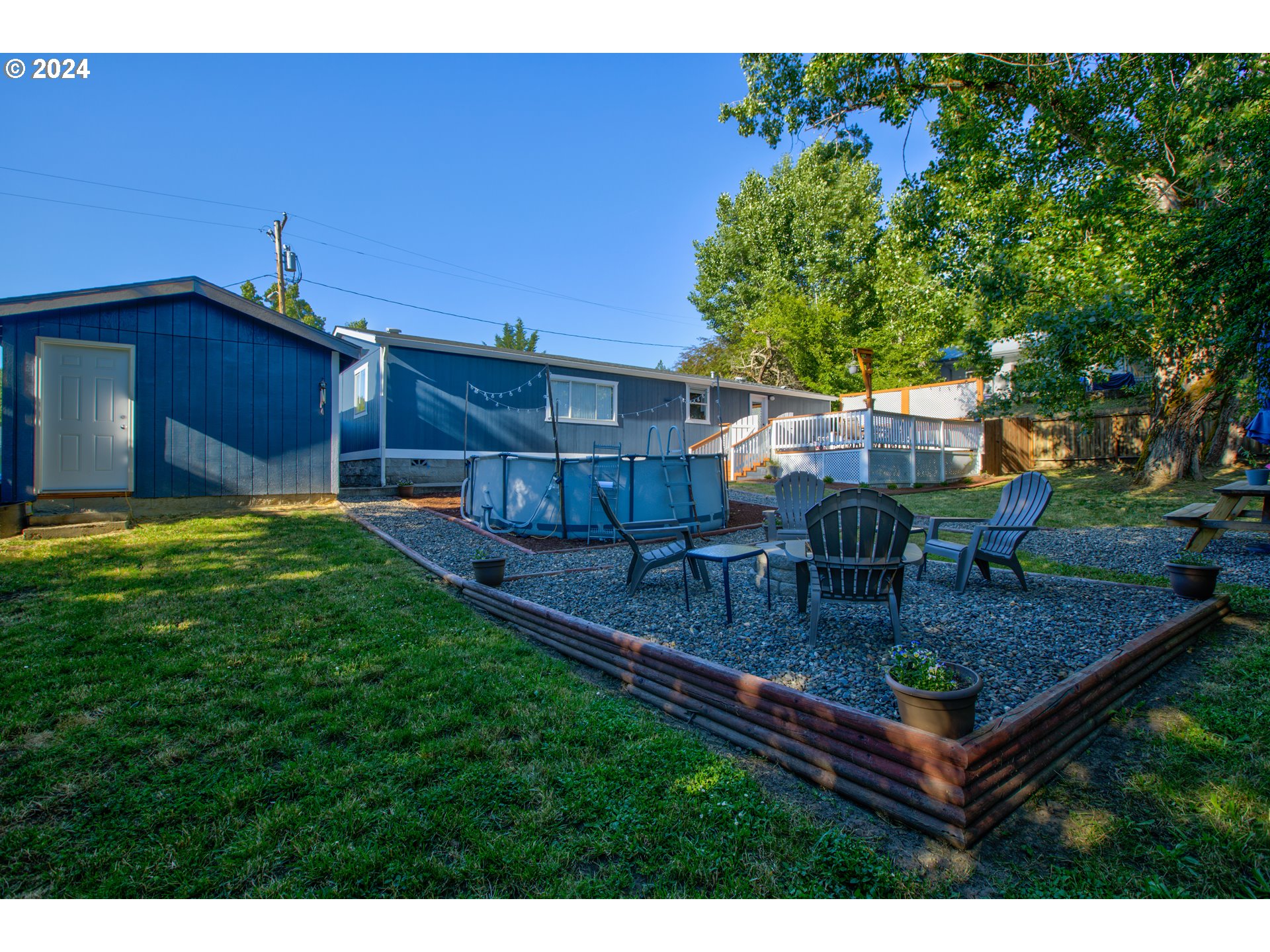 929 Northeast Rifle Range Street Roseburg, OR 97470 - Photo 44 of 48 a view of a backyard with sitting area