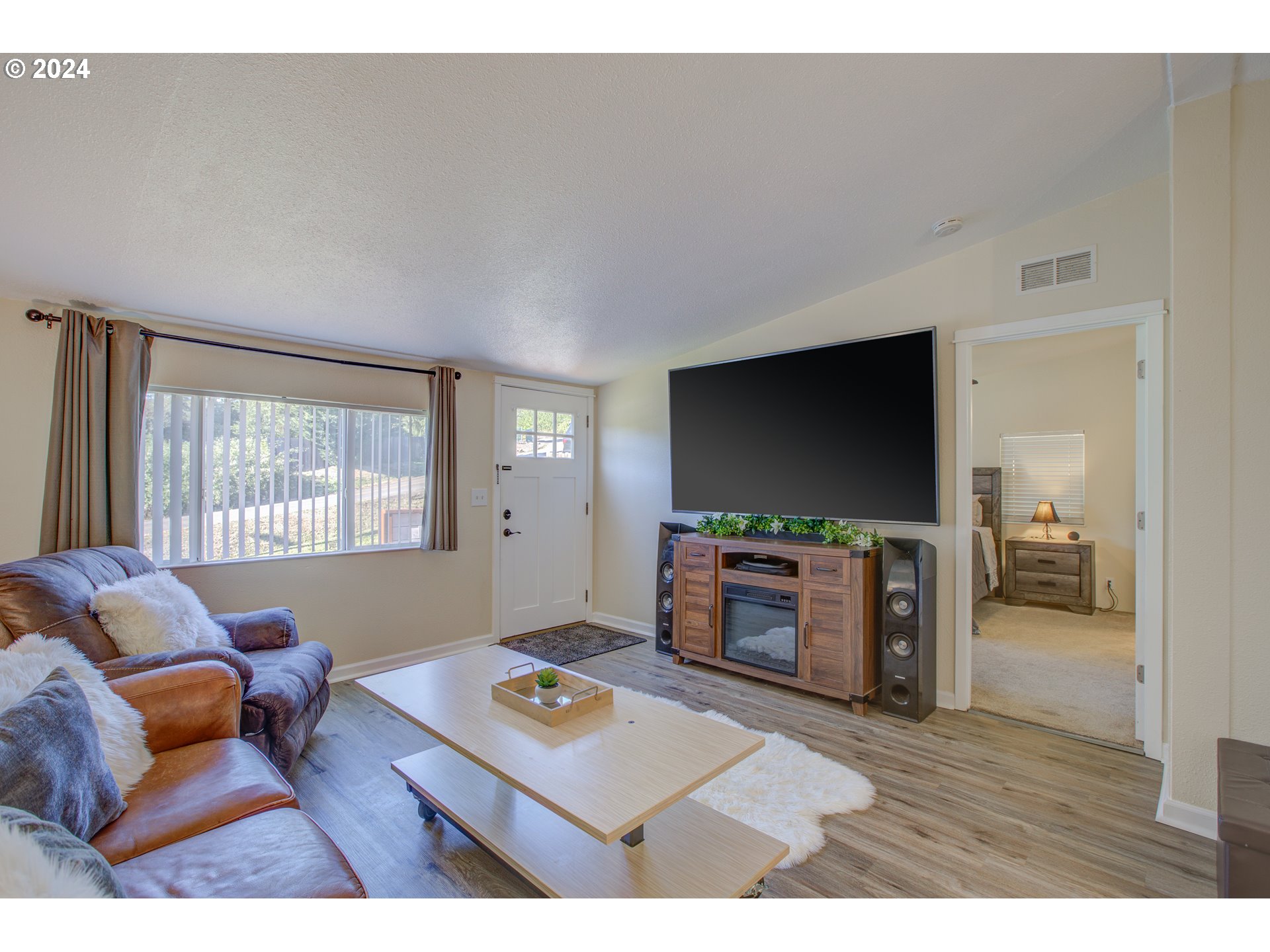 929 Northeast Rifle Range Street Roseburg, OR 97470 - Photo 5 of 48 a living room with furniture and a flat screen tv