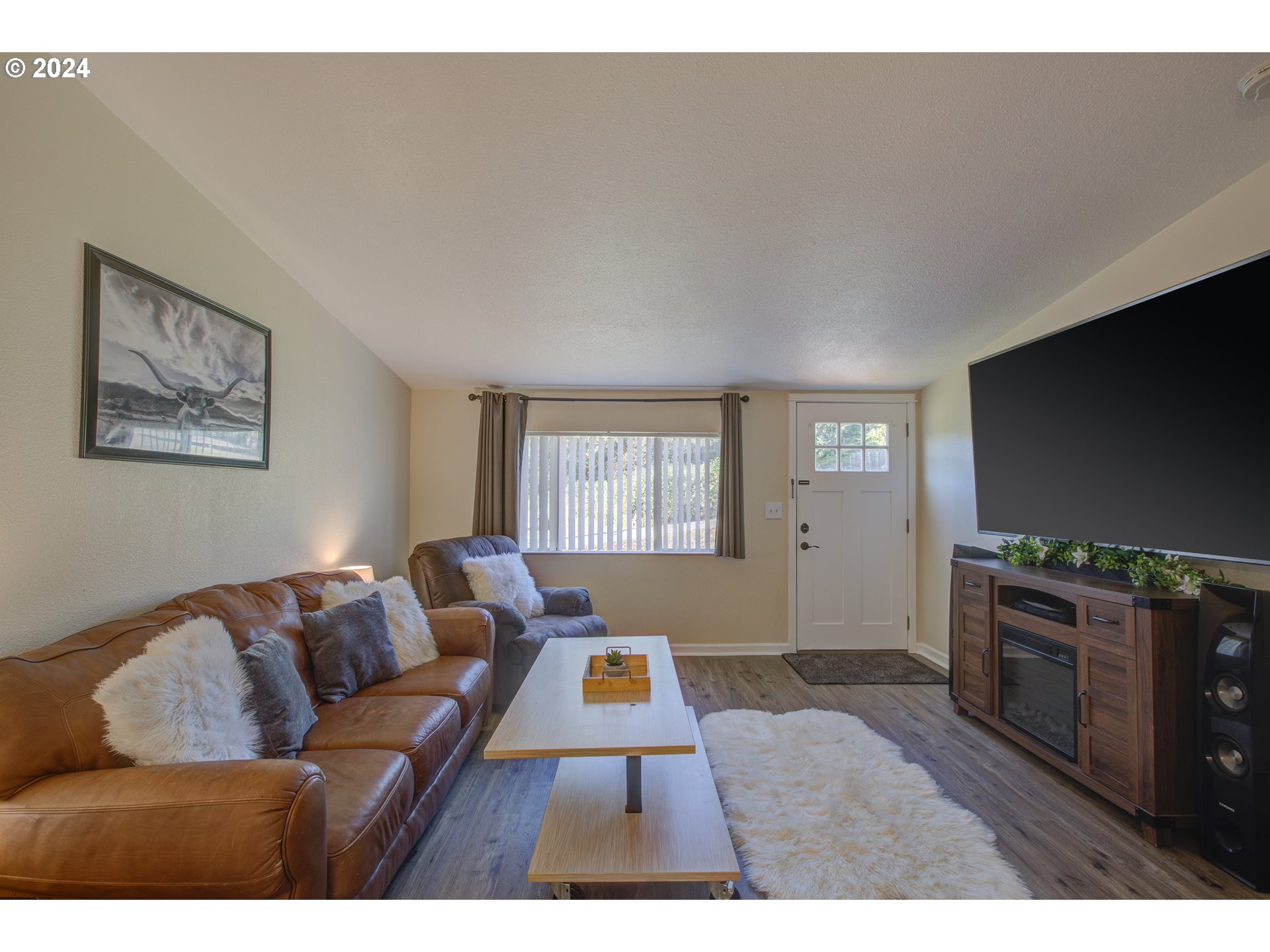929 Northeast Rifle Range Street Roseburg, OR 97470 - Photo 6 of 48 a living room with furniture and a flat screen tv