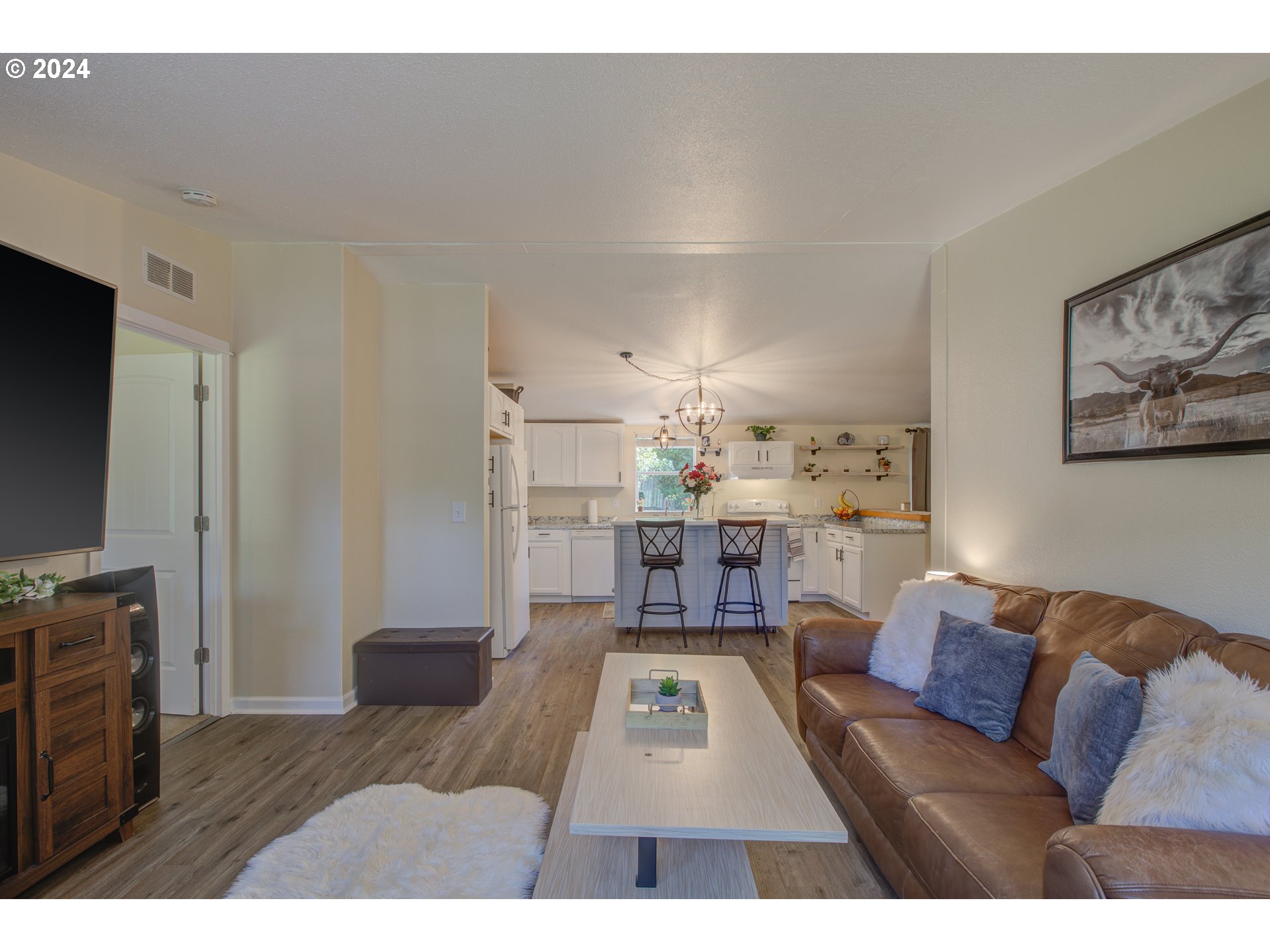 929 Northeast Rifle Range Street Roseburg, OR 97470 - Photo 7 of 48 a living room with furniture and a flat screen tv