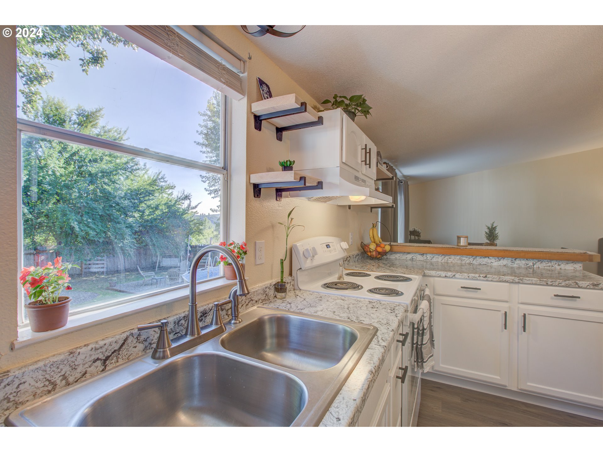 929 Northeast Rifle Range Street Roseburg, OR 97470 - Photo 10 of 48 a kitchen with a sink and cabinets