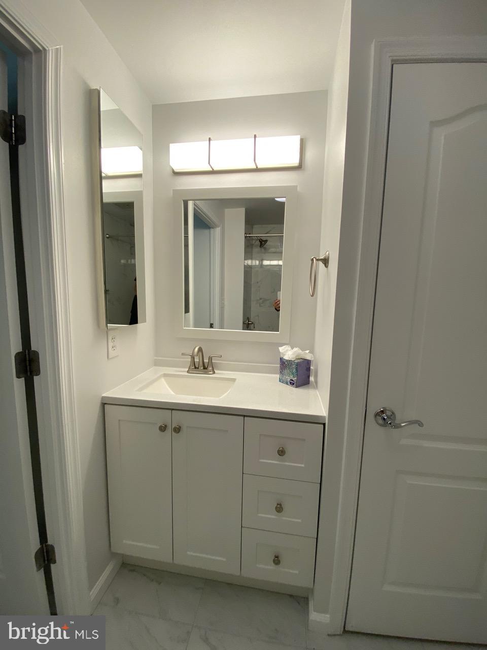 1111 11th Street Northwest, Unit 108 Washington, DC 20001 - Photo 16 of 27 Sleek modern bathroom with elegant finishes.