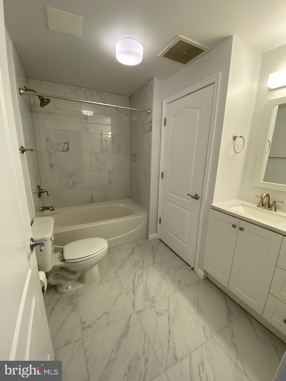 1111 11th Street Northwest, Unit 108 Washington, DC 20001 - Photo 20 of 27 Modern bathroom with elegant marble tiles.