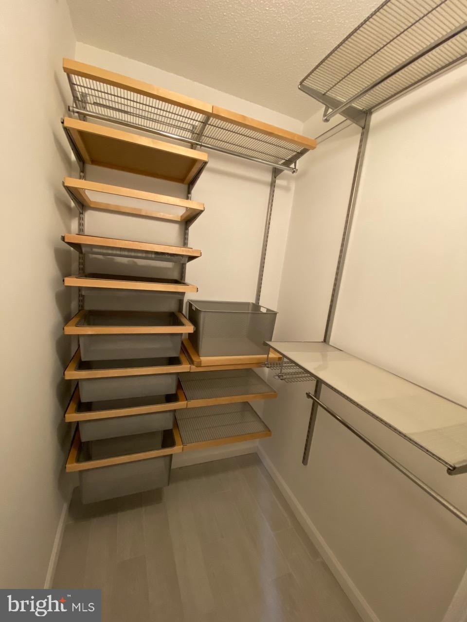 1111 11th Street Northwest, Unit 108 Washington, DC 20001 - Photo 22 of 27 Sleek, organized closet with ample storage.