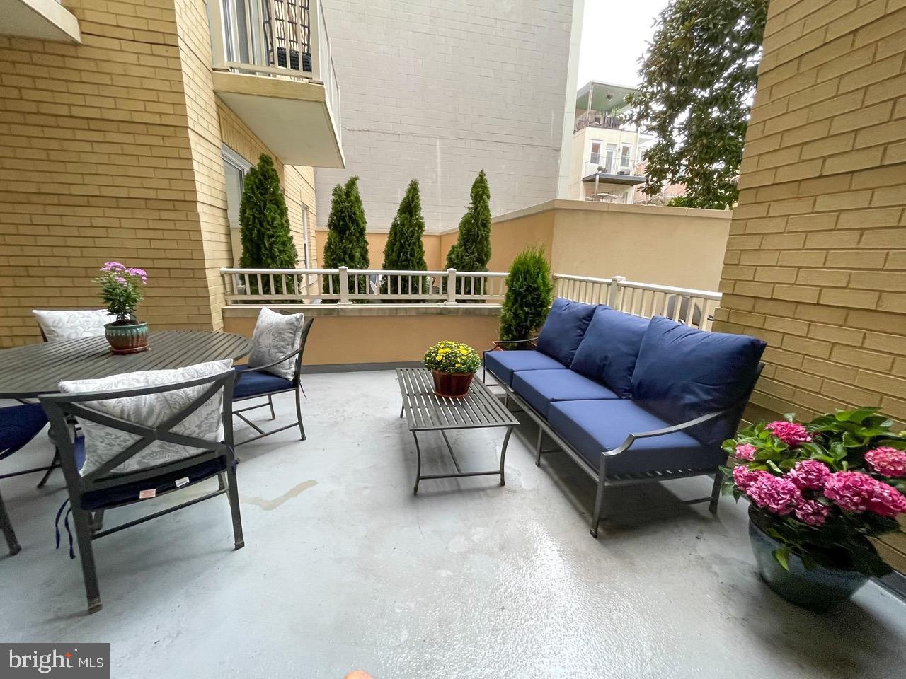 1111 11th Street Northwest, Unit 108 Washington, DC 20001 - Photo 25 of 27 Charming patio oasis with lush greenery.
