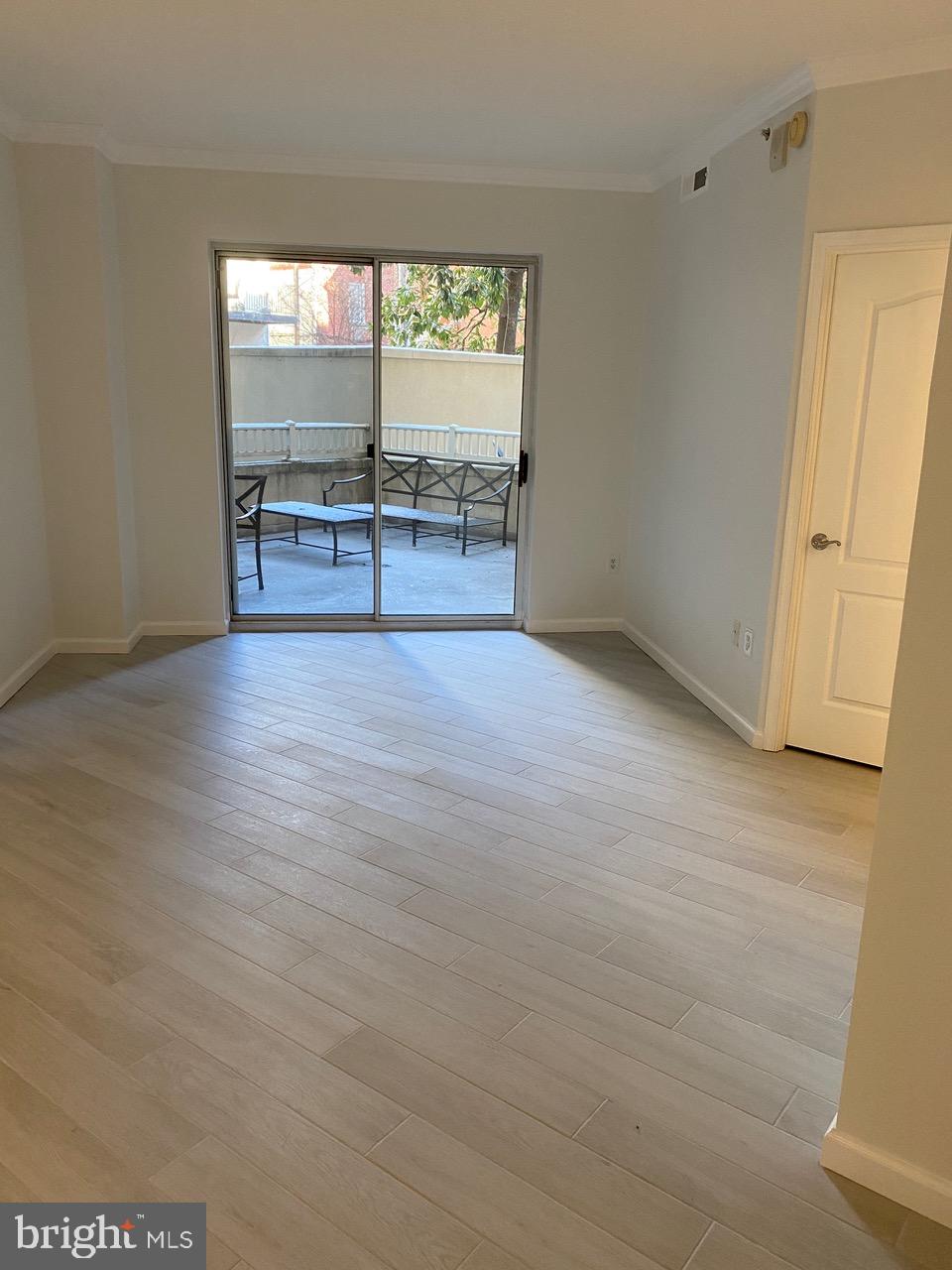 1111 11th Street Northwest, Unit 108 Washington, DC 20001 - Photo 6 of 27 Living Room Facing the Private Patio
