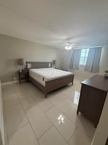 a bedroom with a bed and a cabinets