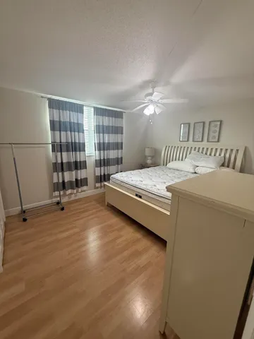 a bedroom with a bed and a walk in closet