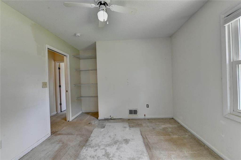 1577 Harbour Oaks Road Tucker, GA 30084 - Photo 43 of 58 an empty room with a empty space and a ceiling fan