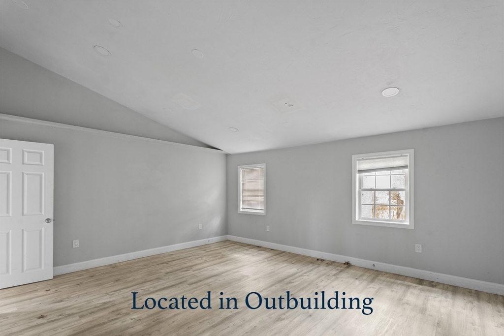 32 Laurel Lane Raynham, MA 02767 - Photo 28 of 30 an empty room with wooden floor and windows