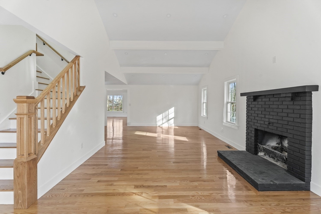 32 Laurel Lane Raynham, MA 02767 - Photo 3 of 30 a living room with furniture and a fireplace