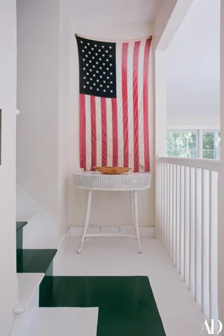 a view of a terrace with lawn chairs