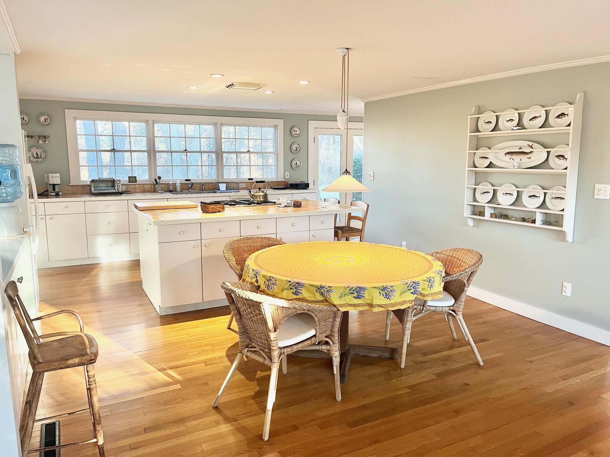86 Scudder's Lane Barnstable, MA 02630 - Photo 6 of 33 a view of a dining room with furniture and wooden floor