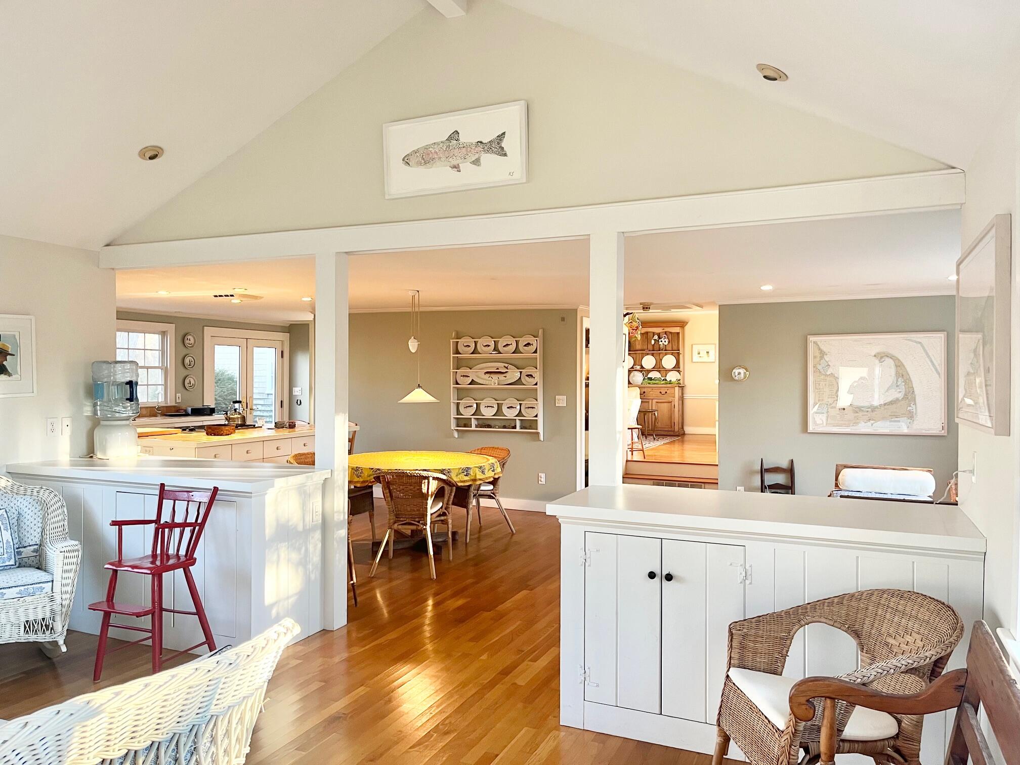 86 Scudder's Lane Barnstable, MA 02630 - Photo 7 of 33 a dining hall with stainless steel appliances kitchen island granite countertop a dining table chairs and a refrigerator