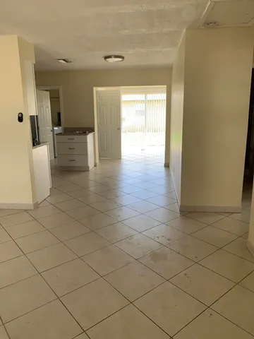 a view of an empty room and a window