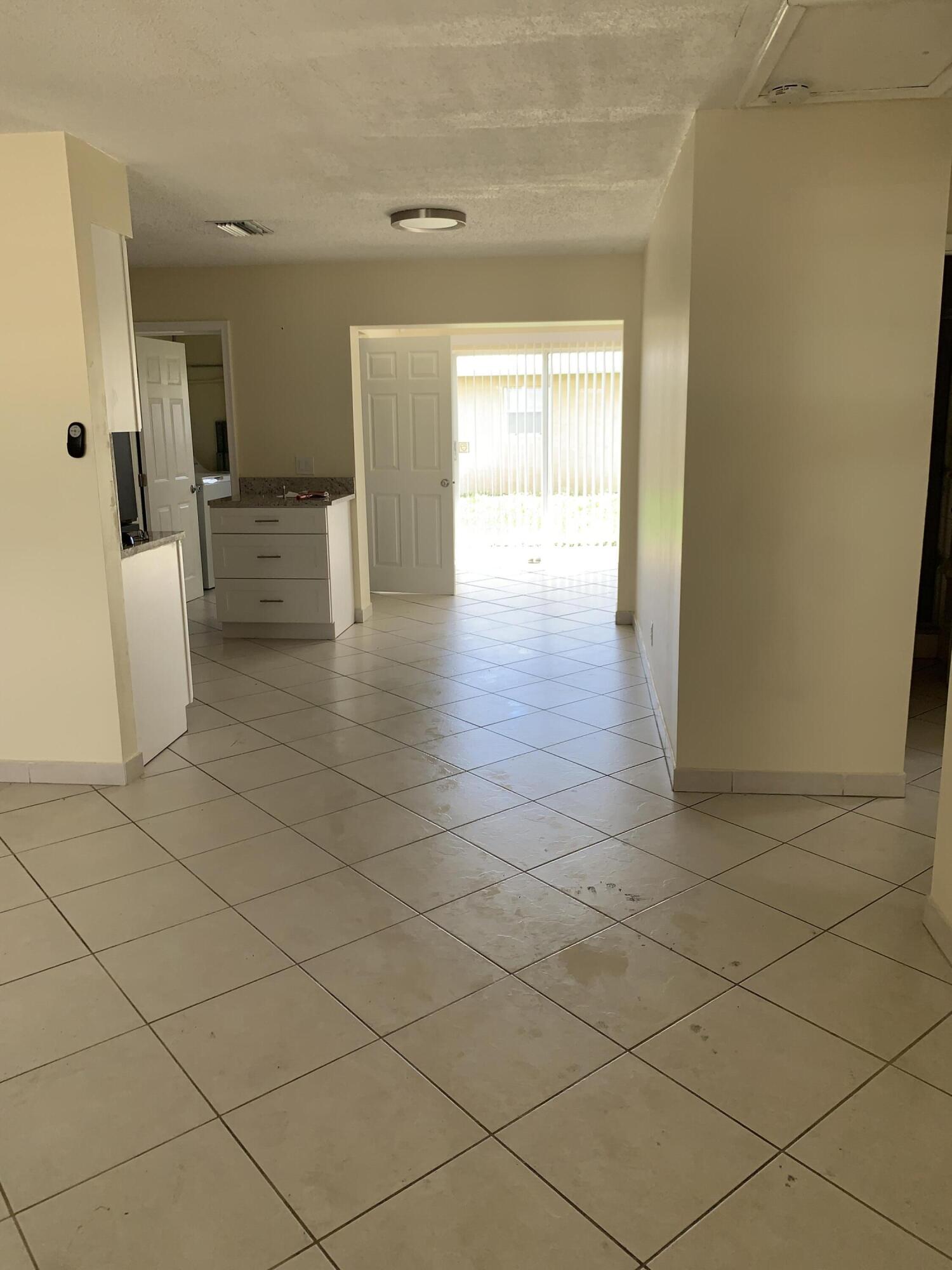 2802 Regency Court Delray Beach, FL 33445 - Photo 2 of 10 a view of an empty room and a window