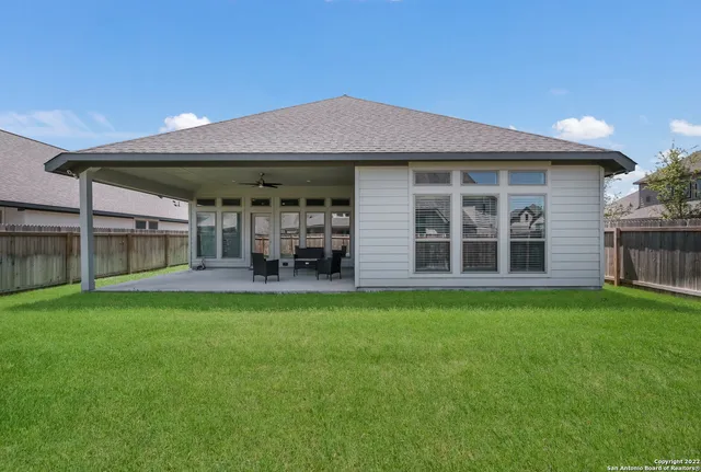a view of a house with backyard porch and garden