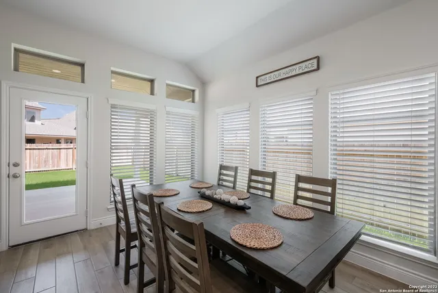a view of a dining room and livingroom with furniture
