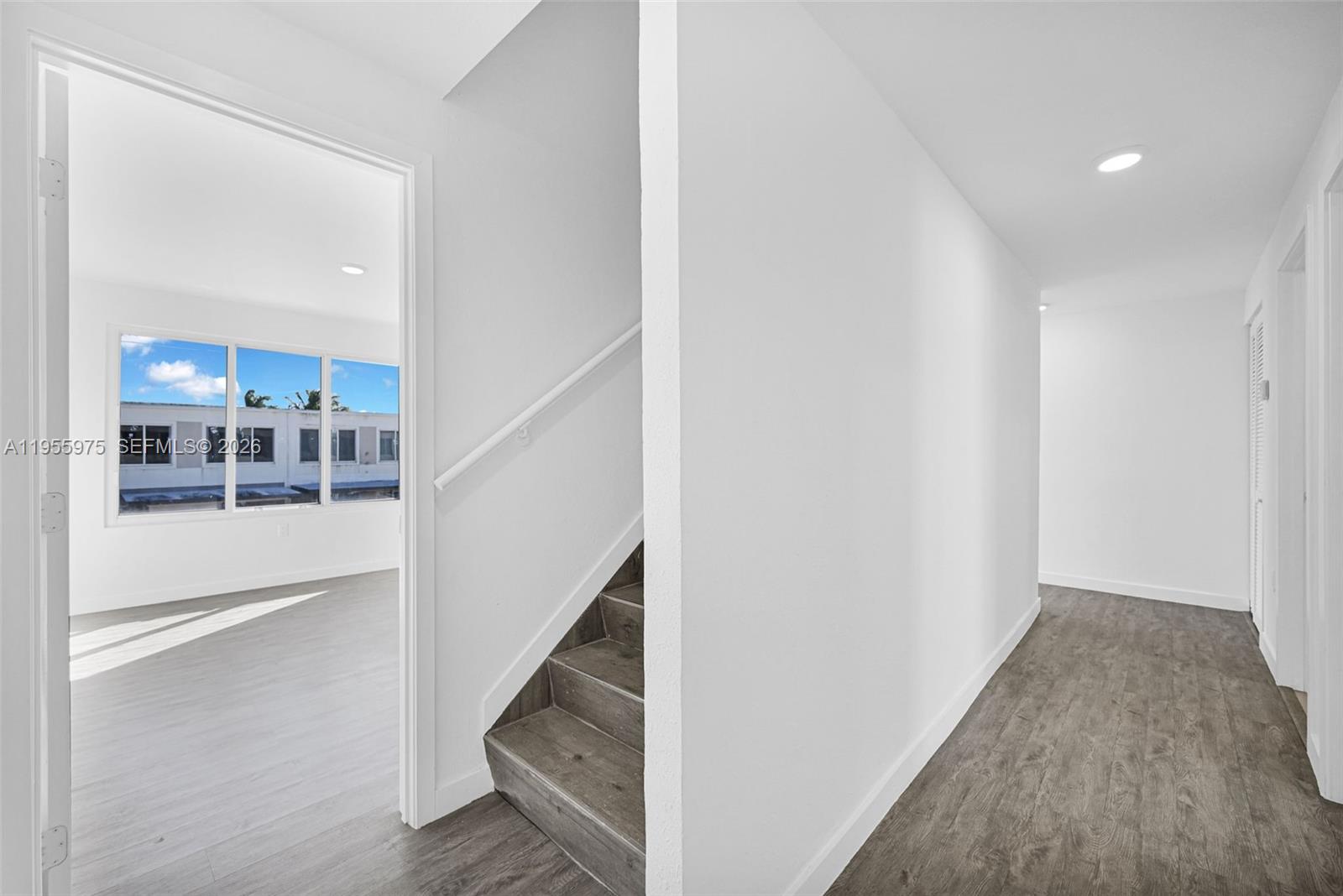 25874 Southwest 139th Court Homestead, FL 33033 - Photo 18 of 56 a view of entryway and hall with wooden floor