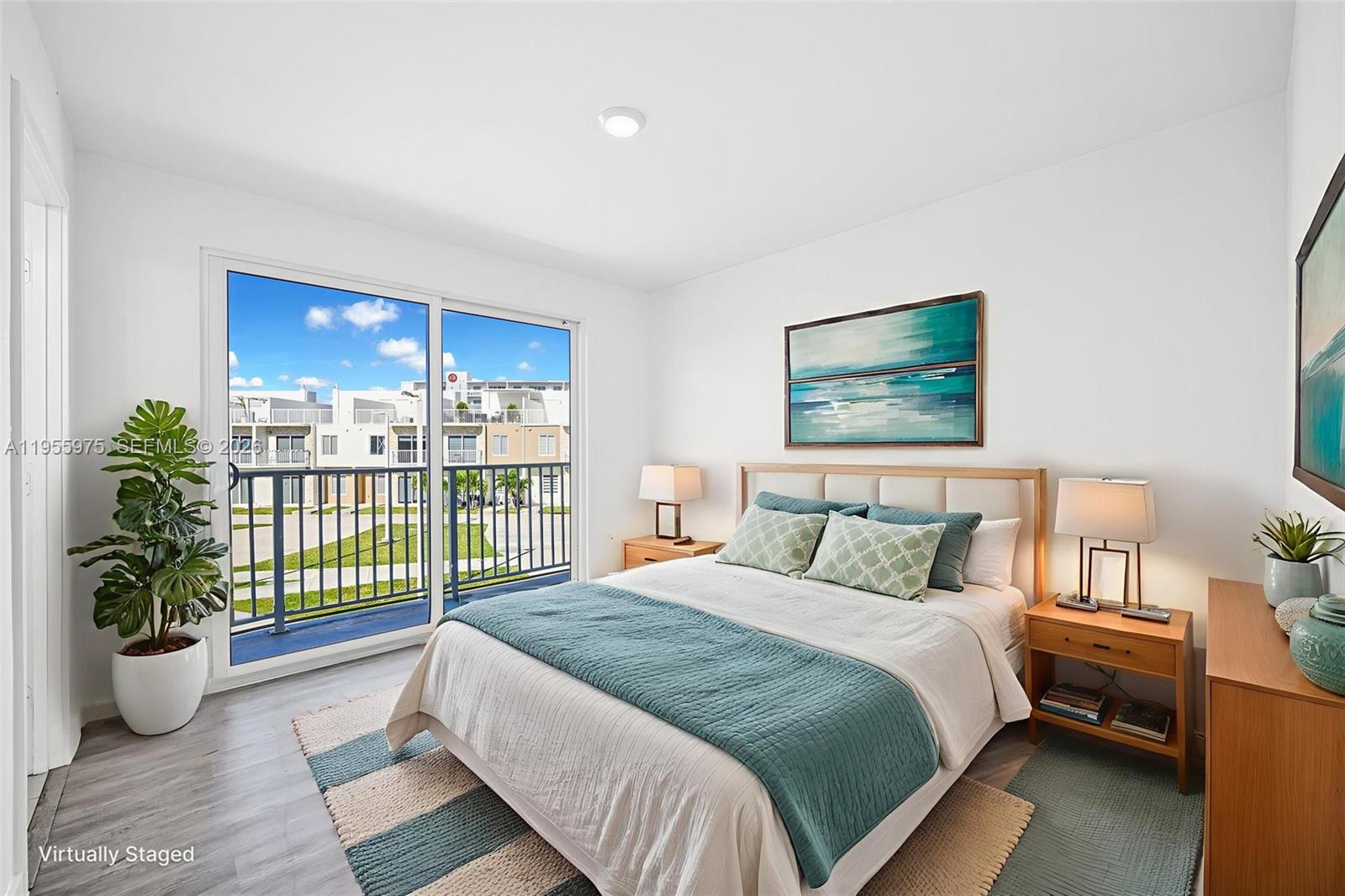25874 Southwest 139th Court Homestead, FL 33033 - Photo 28 of 56 a bedroom with a large bed and a potted plant