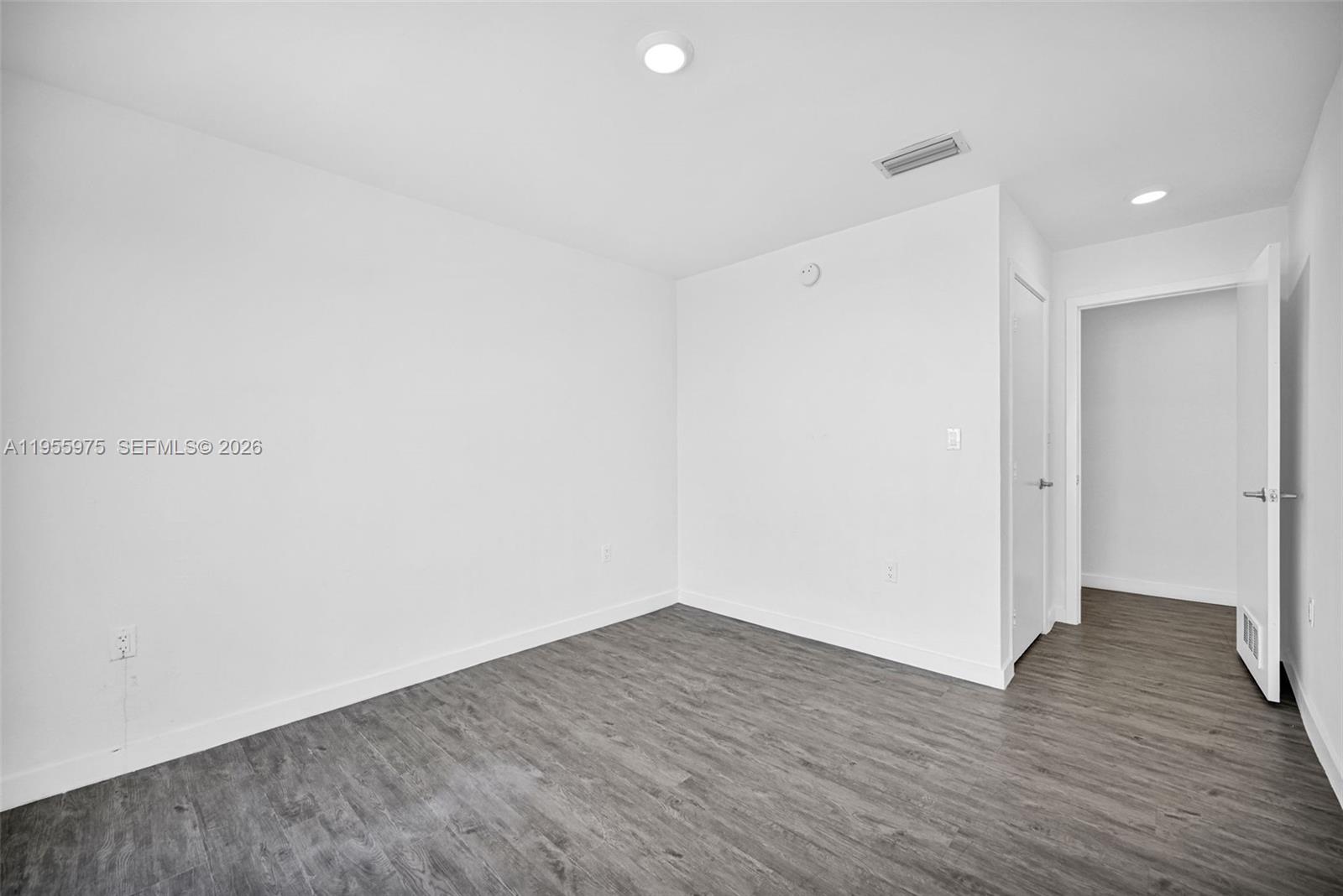 25874 Southwest 139th Court Homestead, FL 33033 - Photo 33 of 56 a view of an empty room with wooden floor