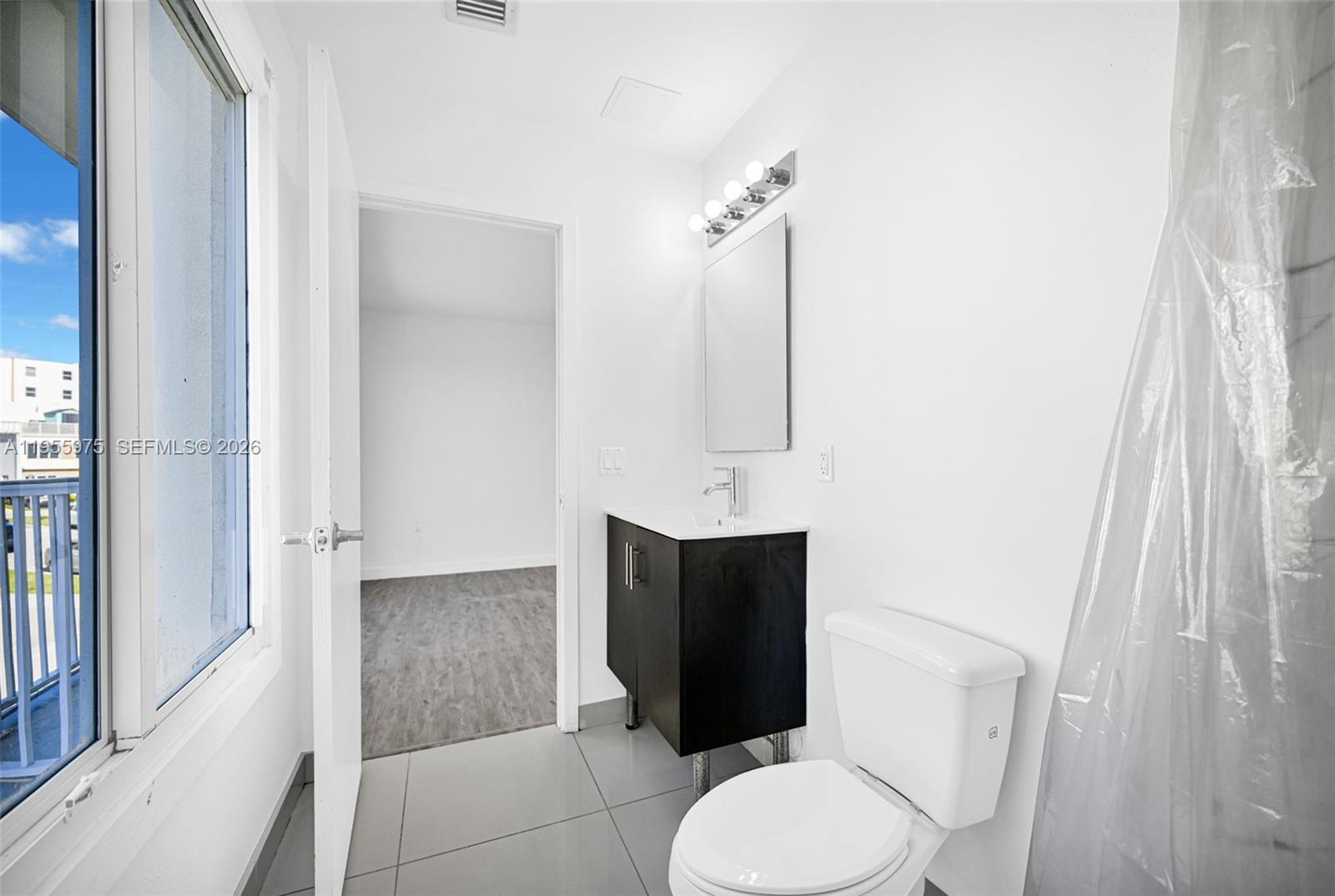 25874 Southwest 139th Court Homestead, FL 33033 - Photo 37 of 56 a bathroom with a toilet and a sink