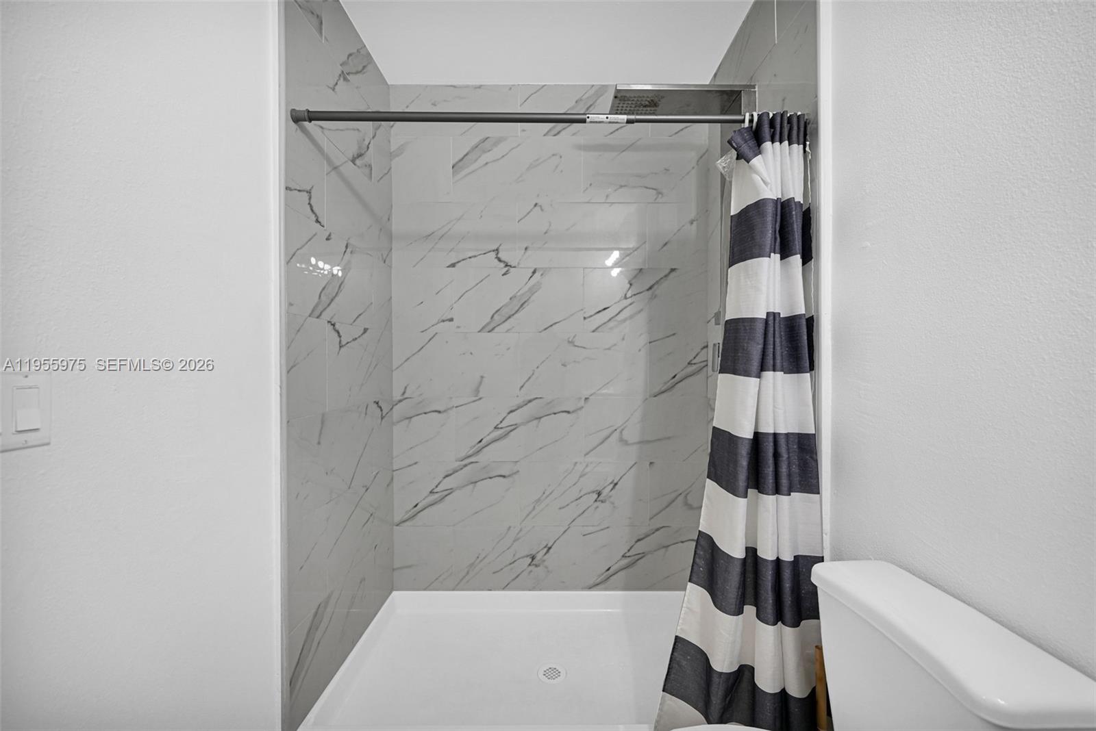 25874 Southwest 139th Court Homestead, FL 33033 - Photo 44 of 56 a bathroom with a bathtub and a shower