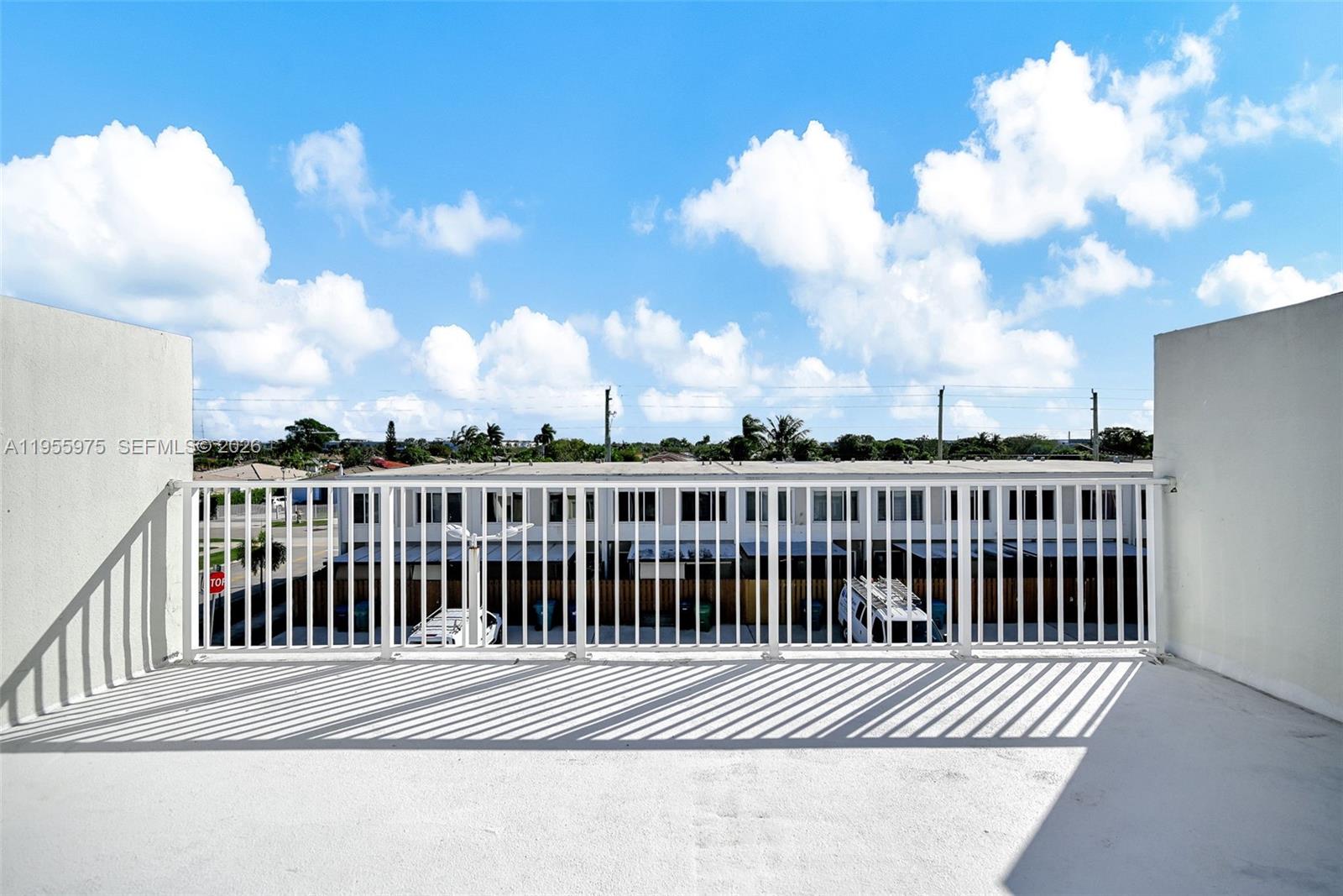 25874 Southwest 139th Court Homestead, FL 33033 - Photo 51 of 56 a view of a balcony with wooden fence