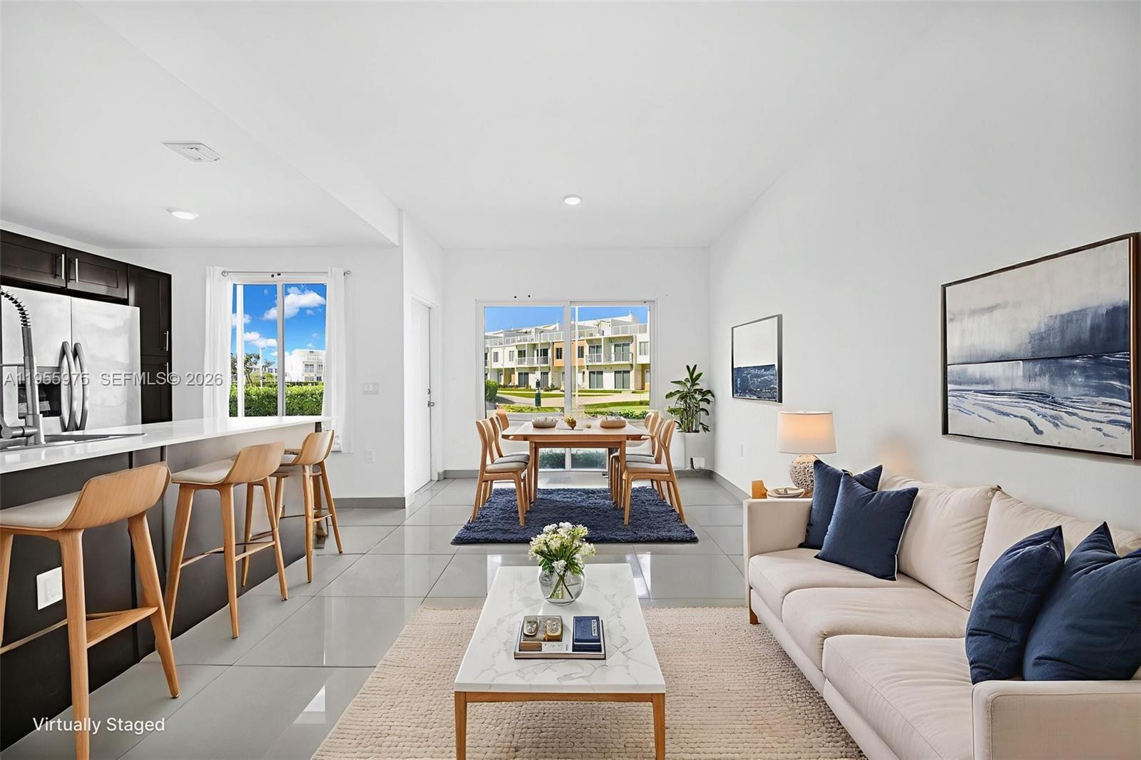 25874 Southwest 139th Court Homestead, FL 33033 - Photo 6 of 56 a living room with furniture and a flat screen tv