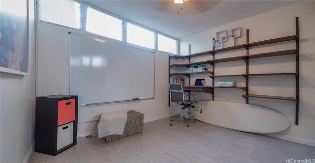 a room with furniture and white walls