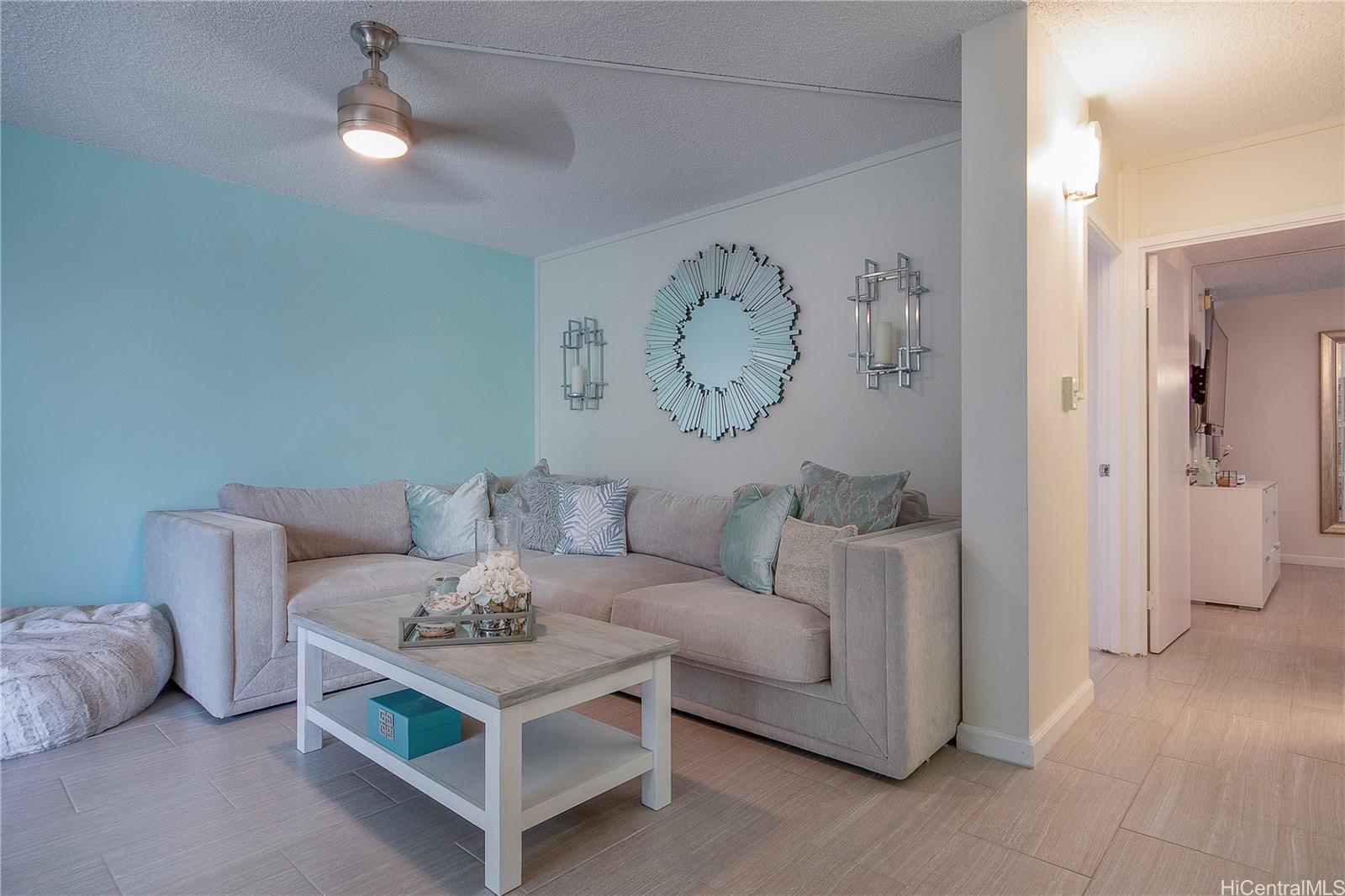 3103 Pualei Circle, Unit 204 Honolulu, HI 96815 - Photo 4 of 17 a living room with furniture and a table