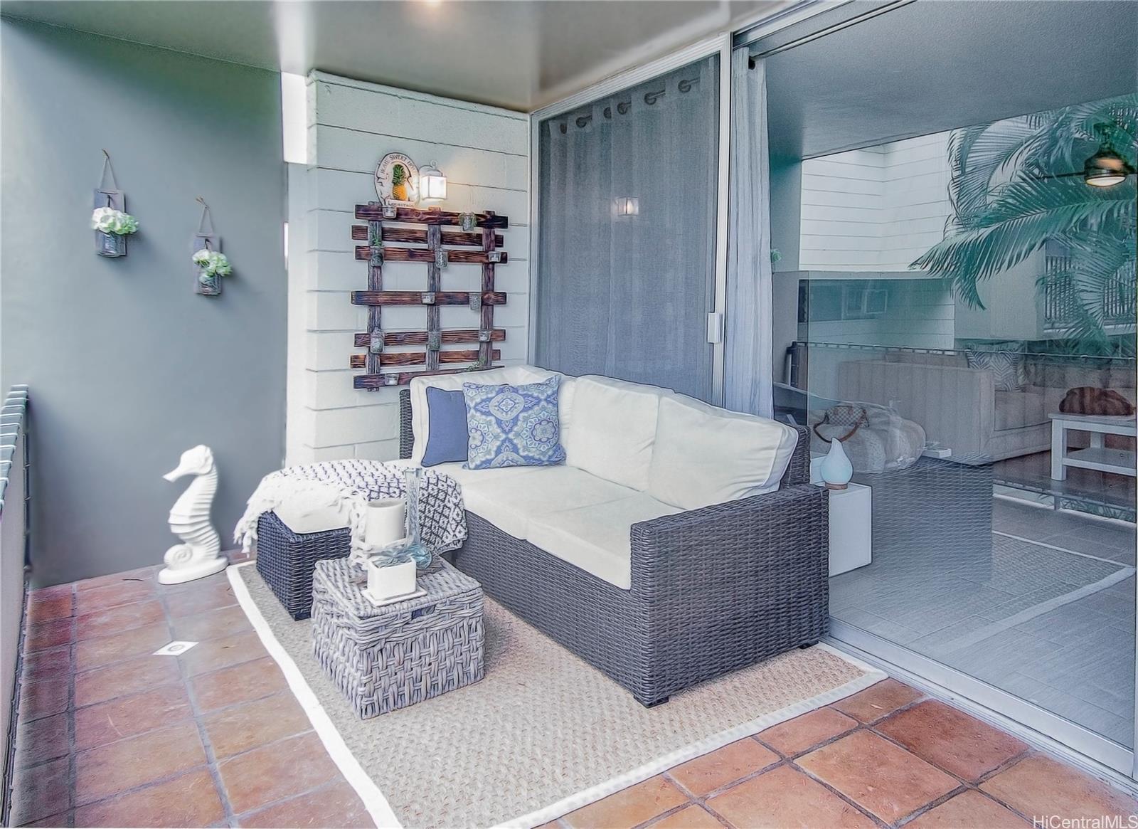 3103 Pualei Circle, Unit 204 Honolulu, HI 96815 - Photo 6 of 17 a living room with furniture and a fireplace