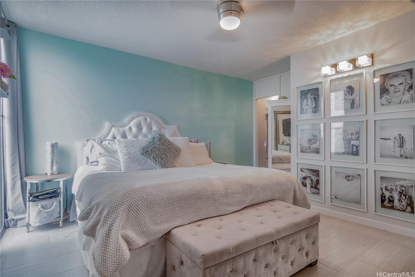 3103 Pualei Circle, Unit 204 Honolulu, HI 96815 - Photo 10 of 17 a bedroom with a bed and a table