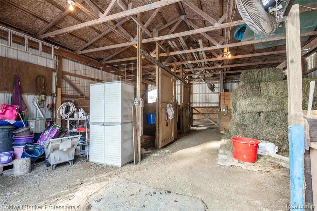 4777 Six Mile Road South Lyon, MI 48178 - Photo 59 of 71 Two horse stalls, the run-in, a storage stay, space for hay and room left over