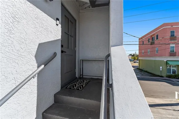 a bathroom with a granite countertop sink toilet a mirror a vanity and shower