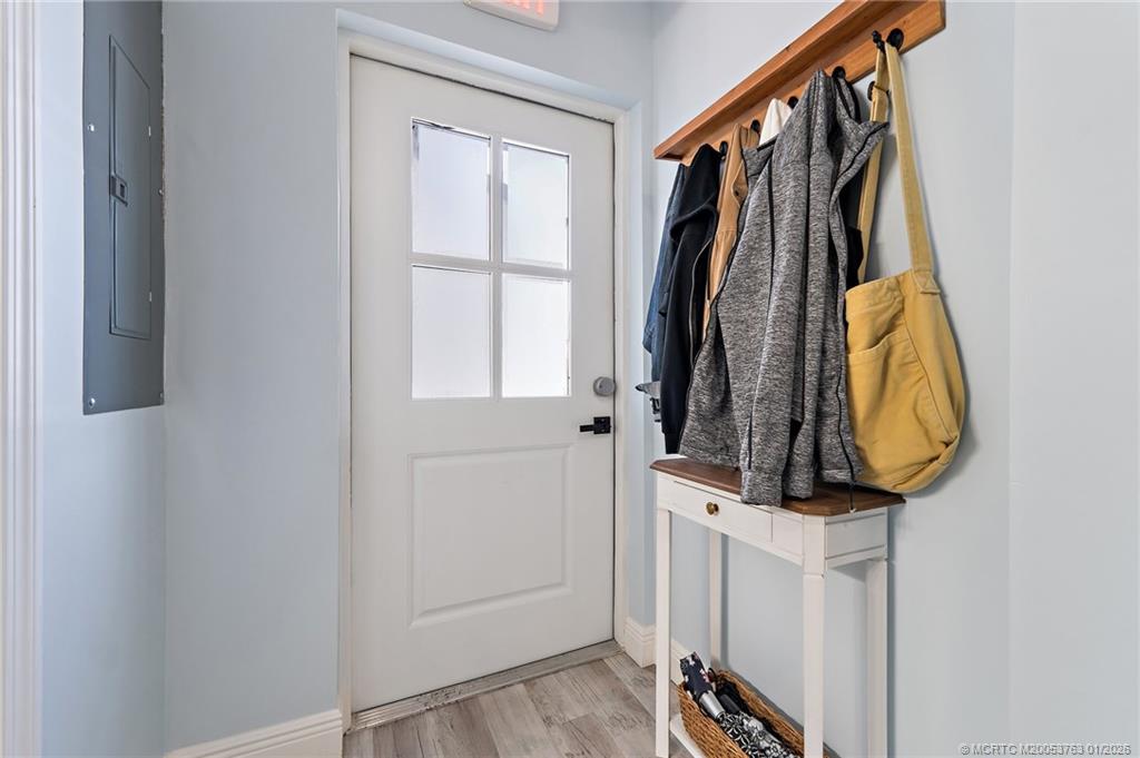 310 Southeast Denver Avenue, Unit 2 Stuart, FL 34994 - Photo 15 of 50 a view of walk in closet with clothes and shoes